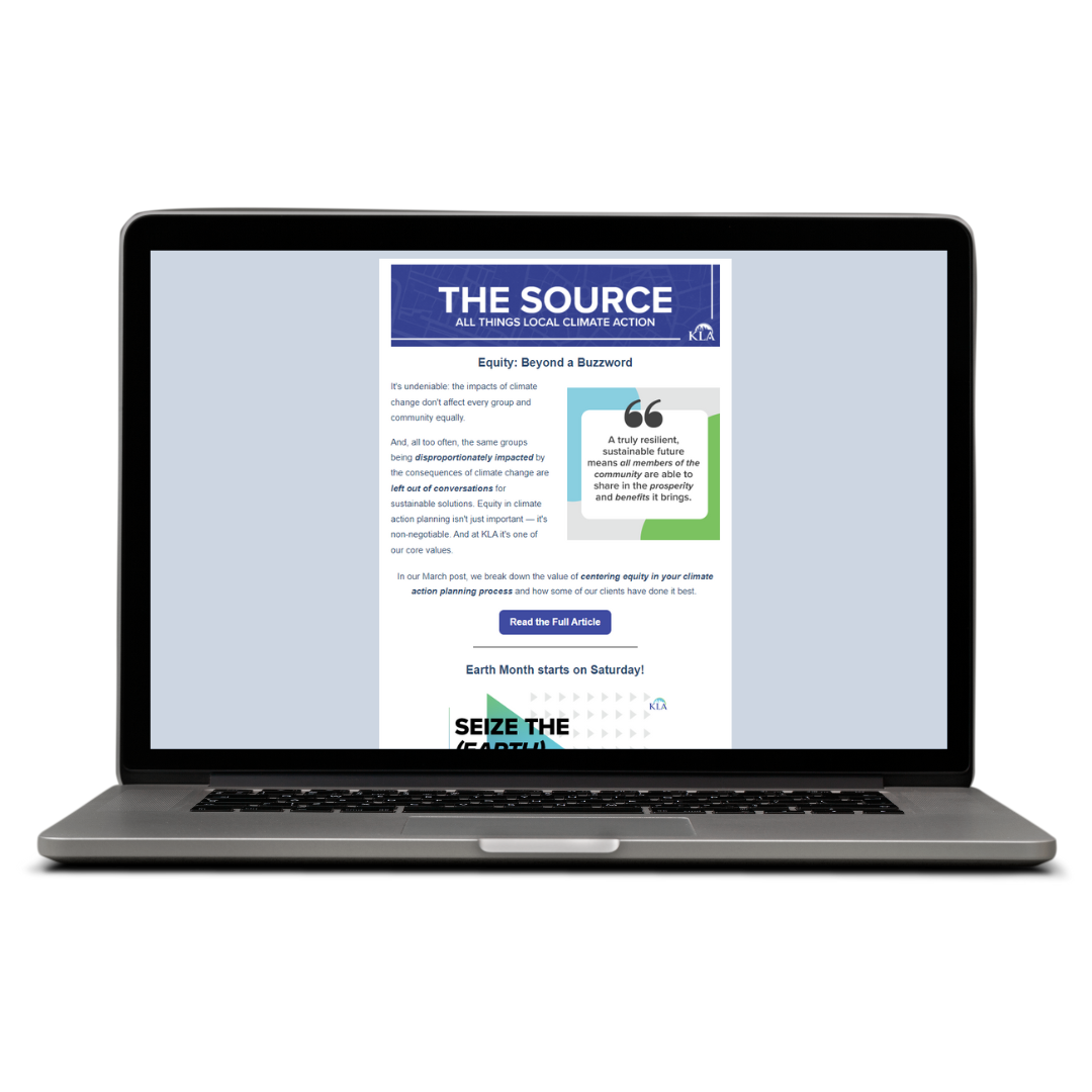 Laptop open with recent "The Source" newsletter open on screen Laptop open with recent "The Source" newsletter open on screen